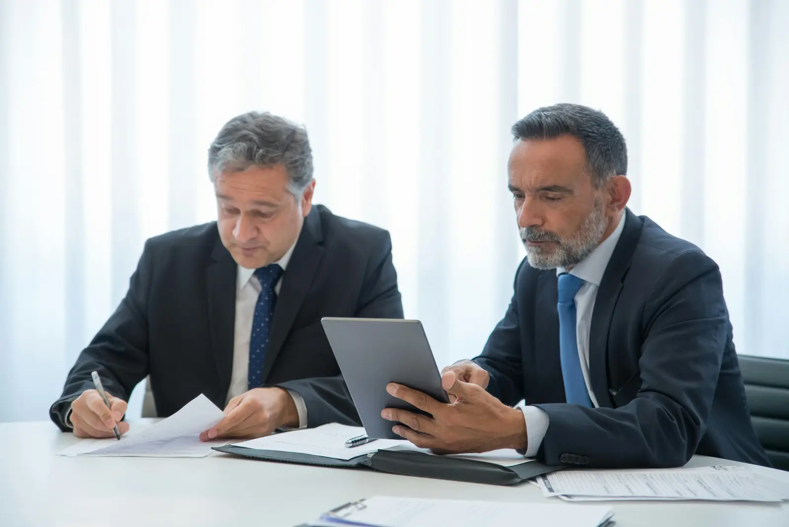Recruiter and hiring manager reviewing candidates together