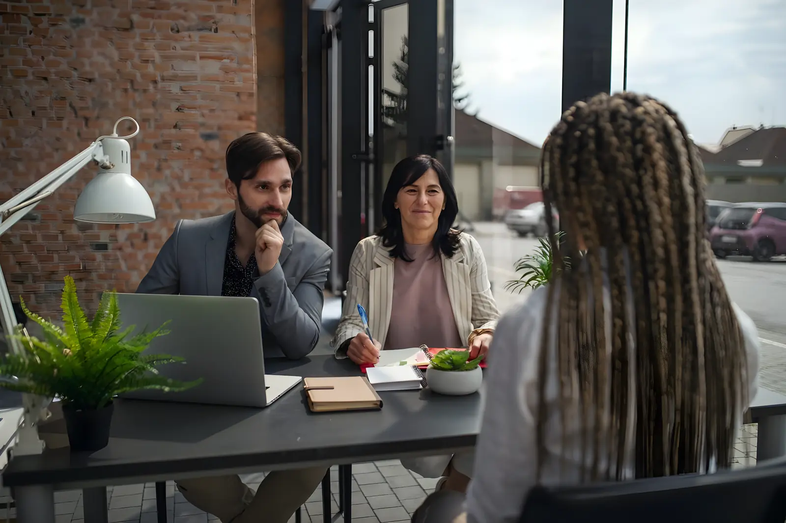 Candidate in a relaxed interview with two hiring managers